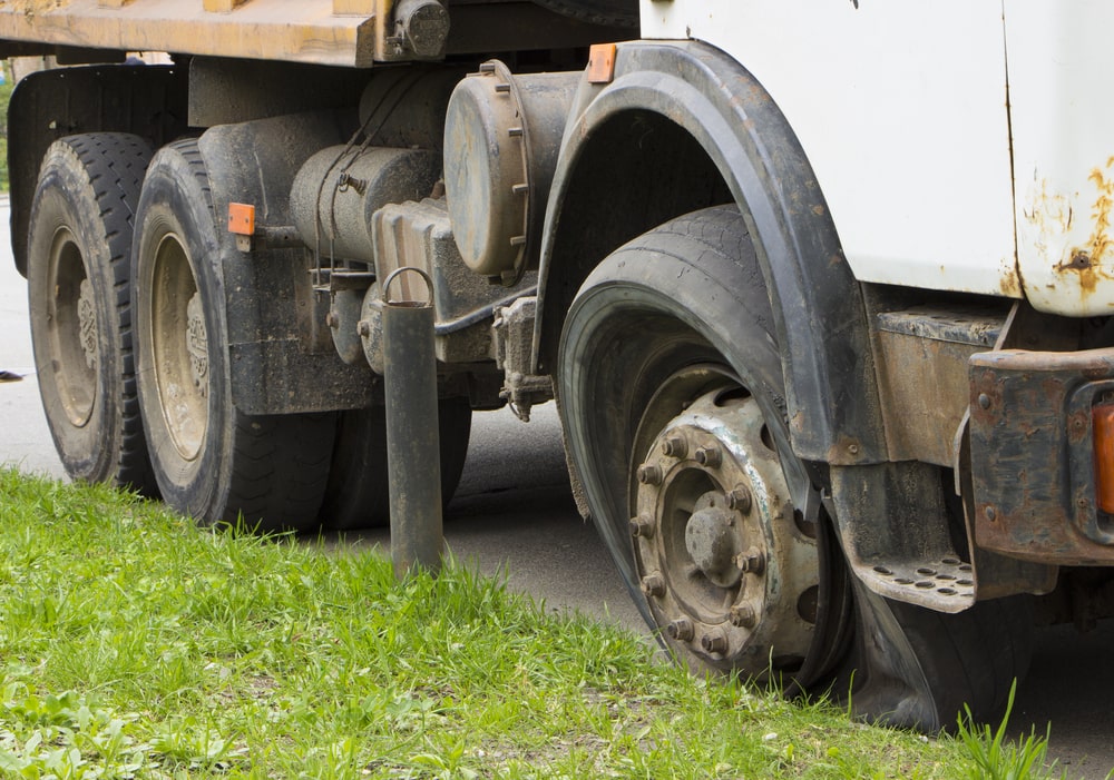 Truck With A Blown Tire