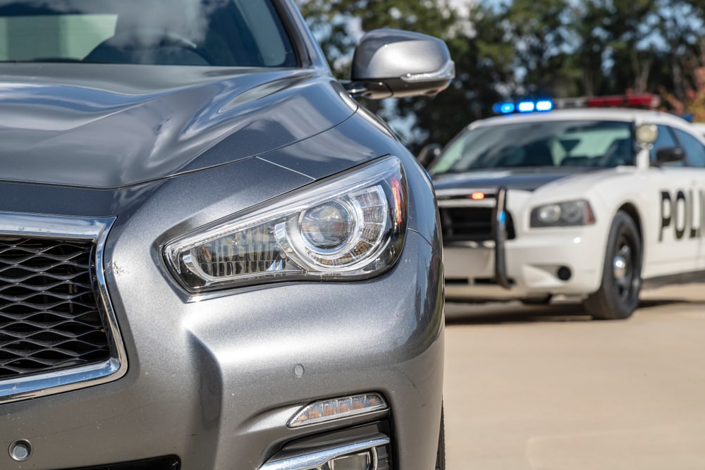 A Grey Car Pulled Over By The Police