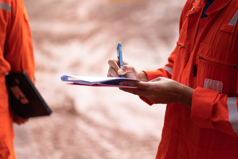 Paramedics Filling Out Documents