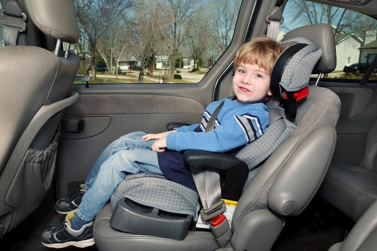 Child Fastened In A Child Seat