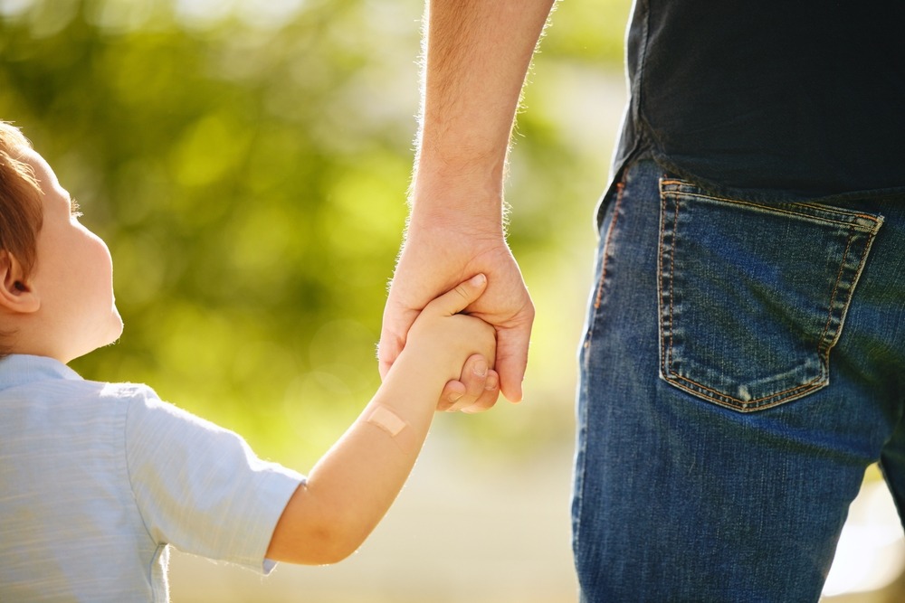 A Father Holding Hands Photo of a Father Holding Hands